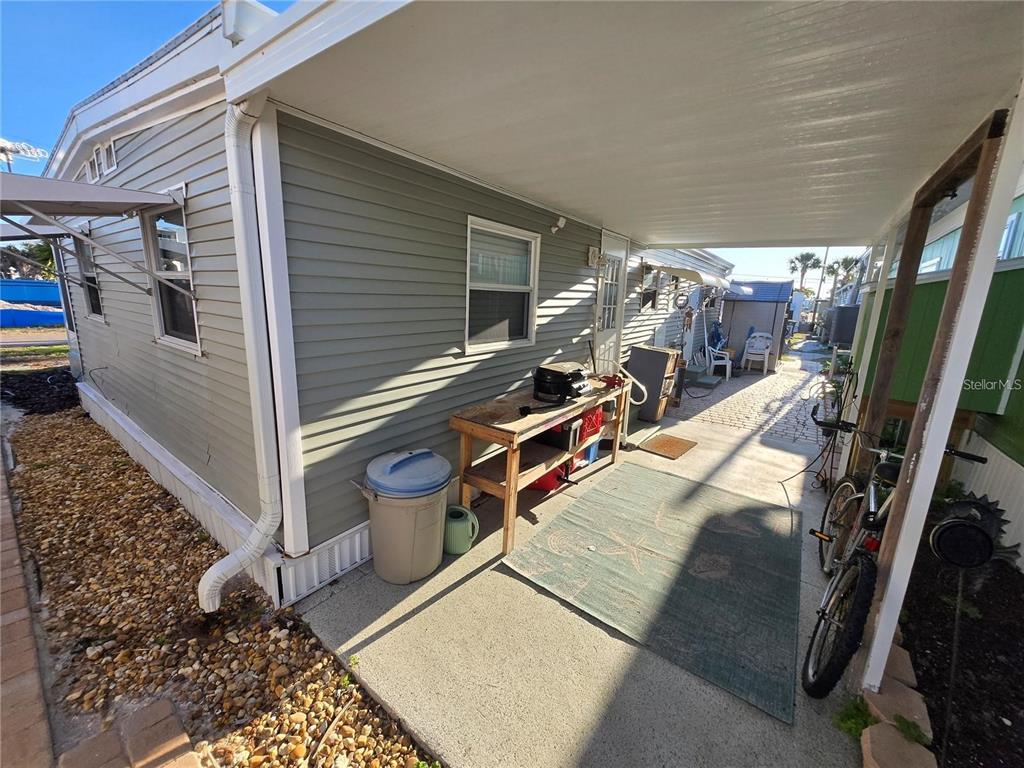 2295 North Beach Road, Unit 23 Englewood, FL 34223 - Photo 14 of 19 a view of a patio with table and chairs