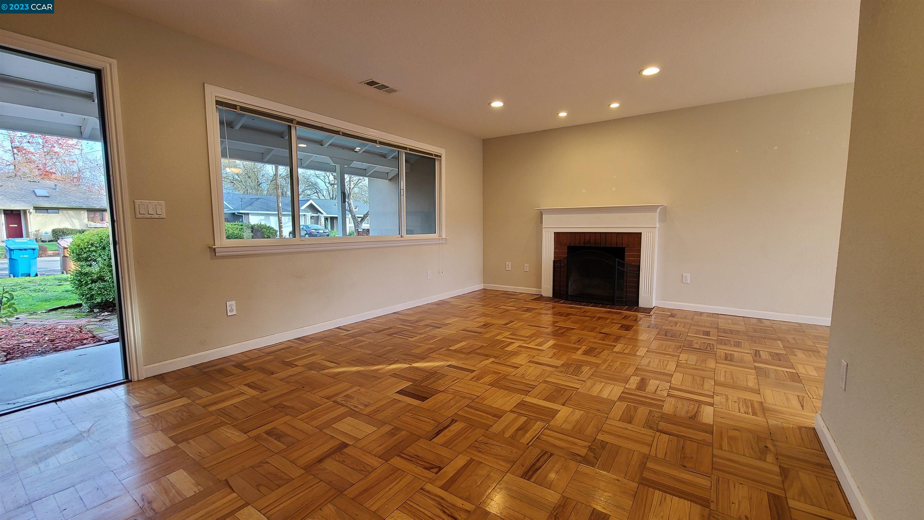 1972 Helen Road Pleasant Hill, CA 94523 - Photo 2 of 15 a view of an empty room with wooden floor and a window