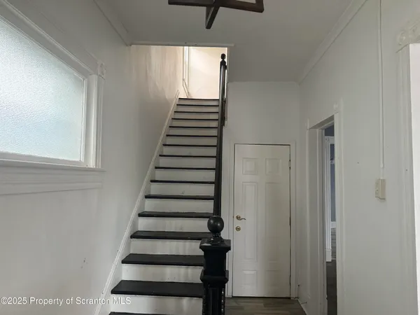 a view of entryway with wooden floor