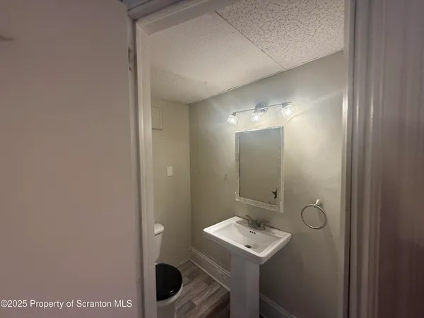 a bathroom with a sink and mirror