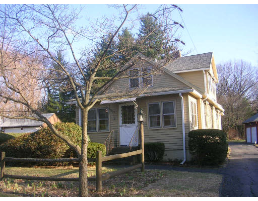 379 Morgan Road West Springfield, MA 01089 - Photo 3 of 6 a view of a house with a yard and large tree