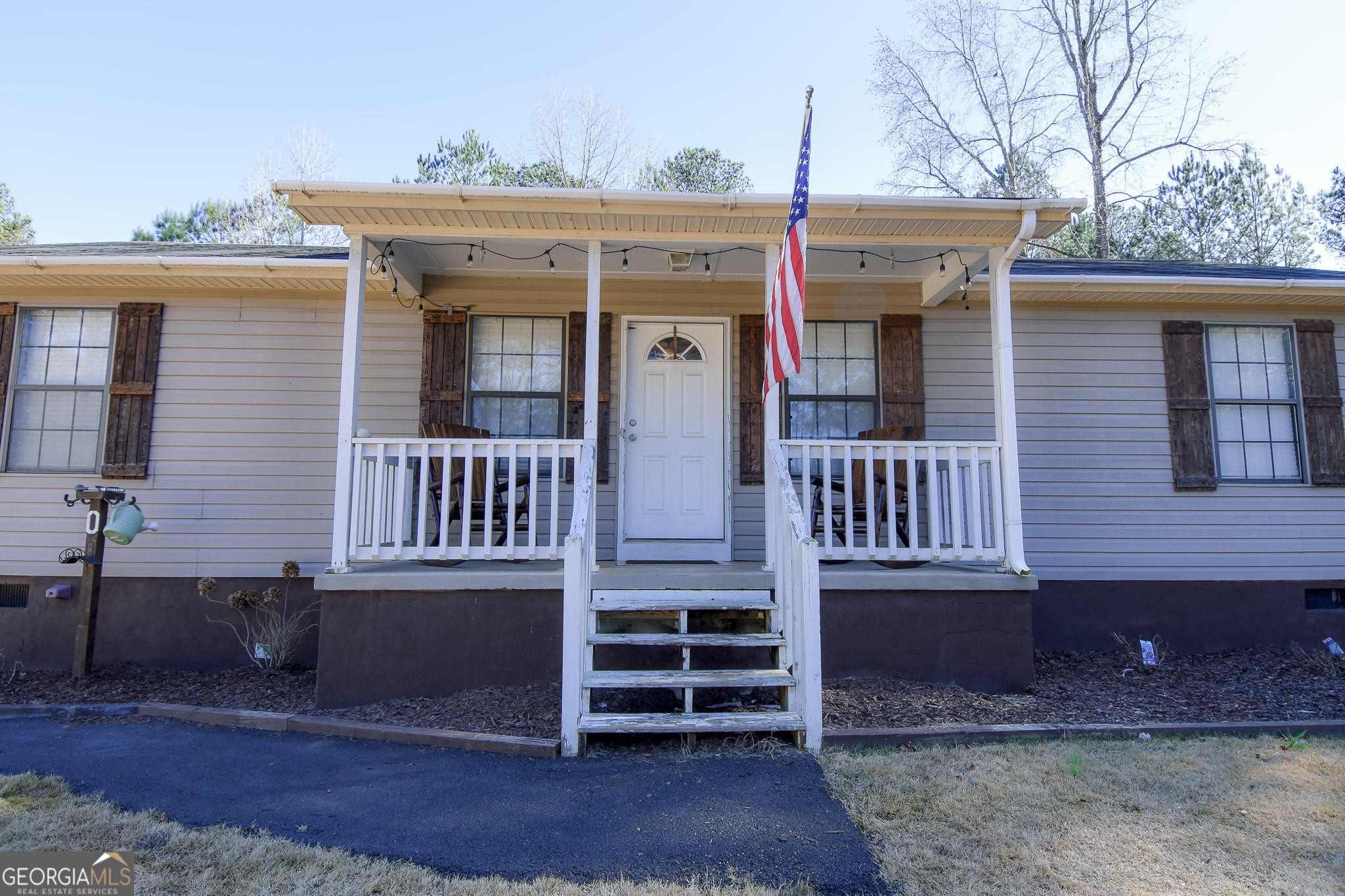 741 Howell Road Zebulon, GA 30295 - Photo 12 of 79 a front view of a house with a yard