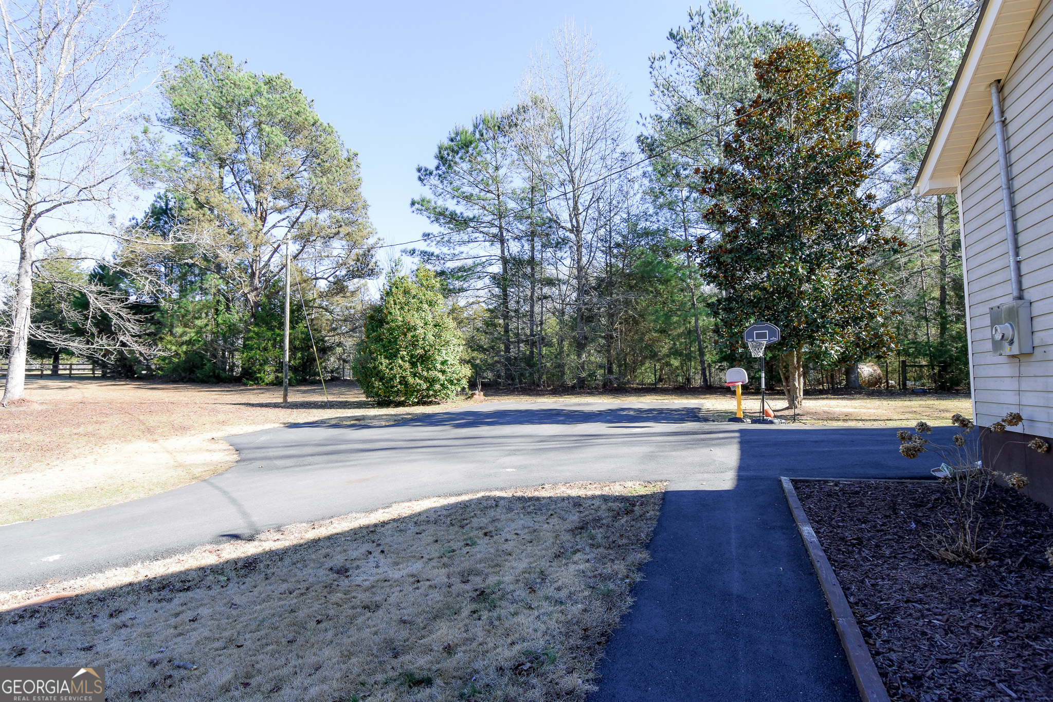 741 Howell Road Zebulon, GA 30295 - Photo 21 of 79 a view of a yard with large trees