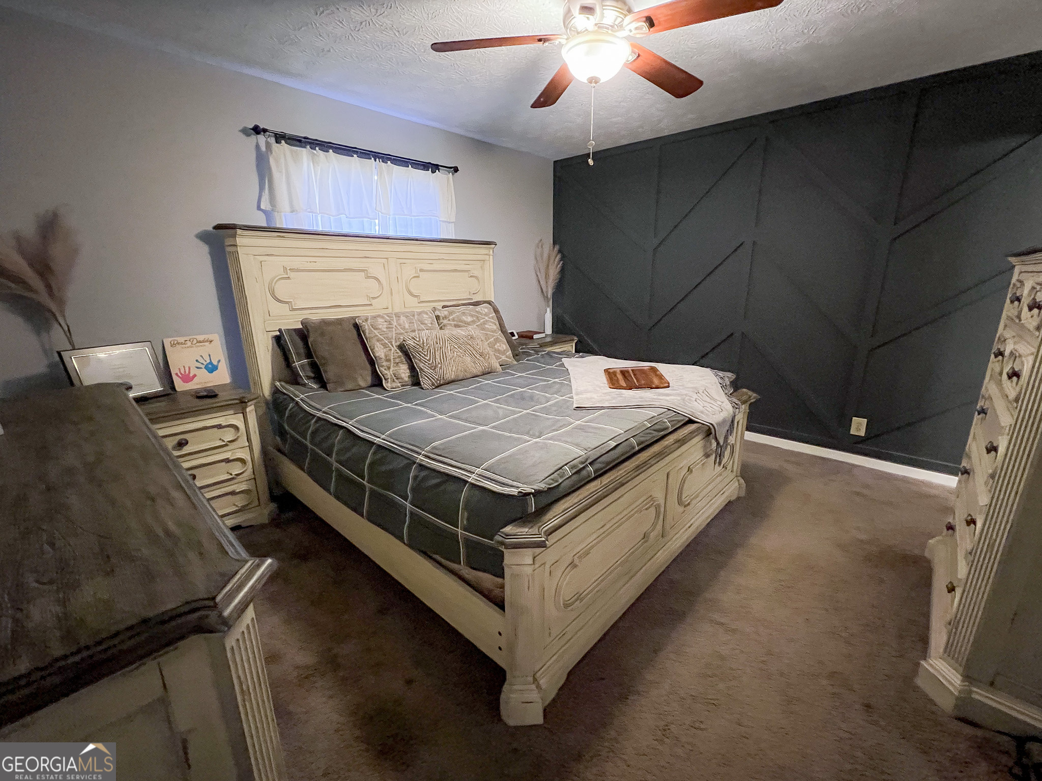 741 Howell Road Zebulon, GA 30295 - Photo 39 of 79 a bed sitting in a bedroom next to a lamp