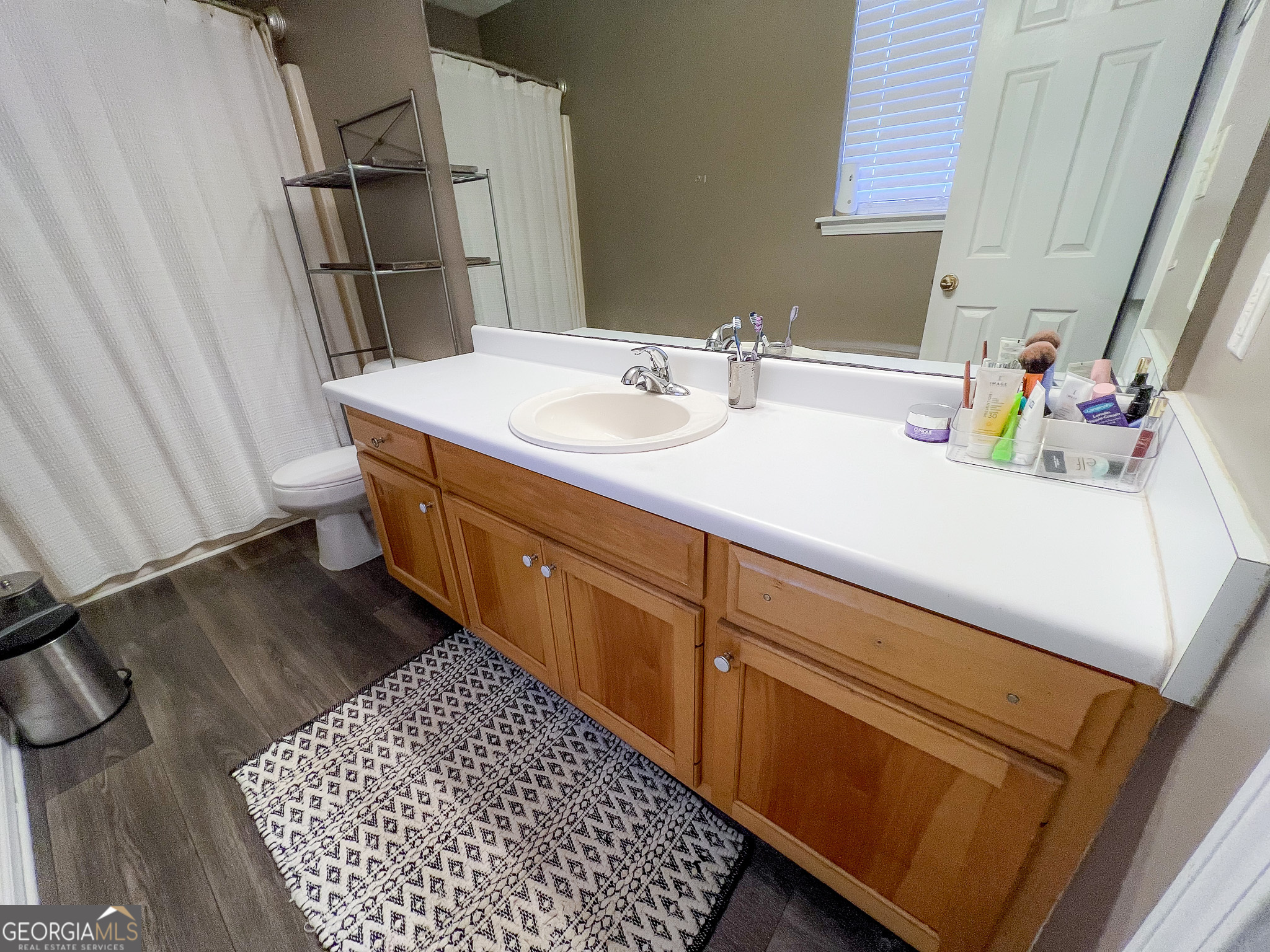 741 Howell Road Zebulon, GA 30295 - Photo 42 of 79 a bathroom with a sink toilet and shower