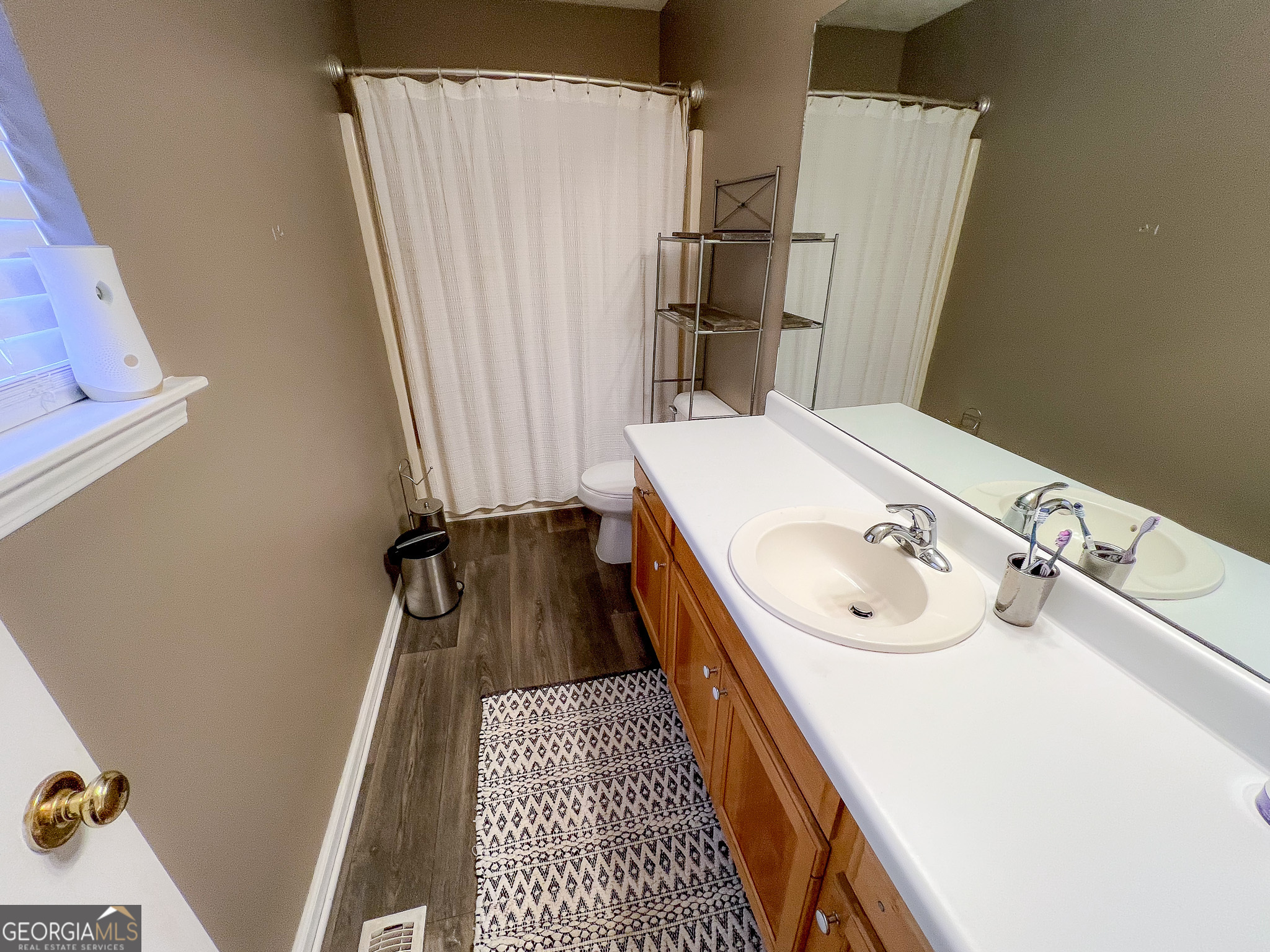 741 Howell Road Zebulon, GA 30295 - Photo 44 of 79 a bathroom with a sink and a tub