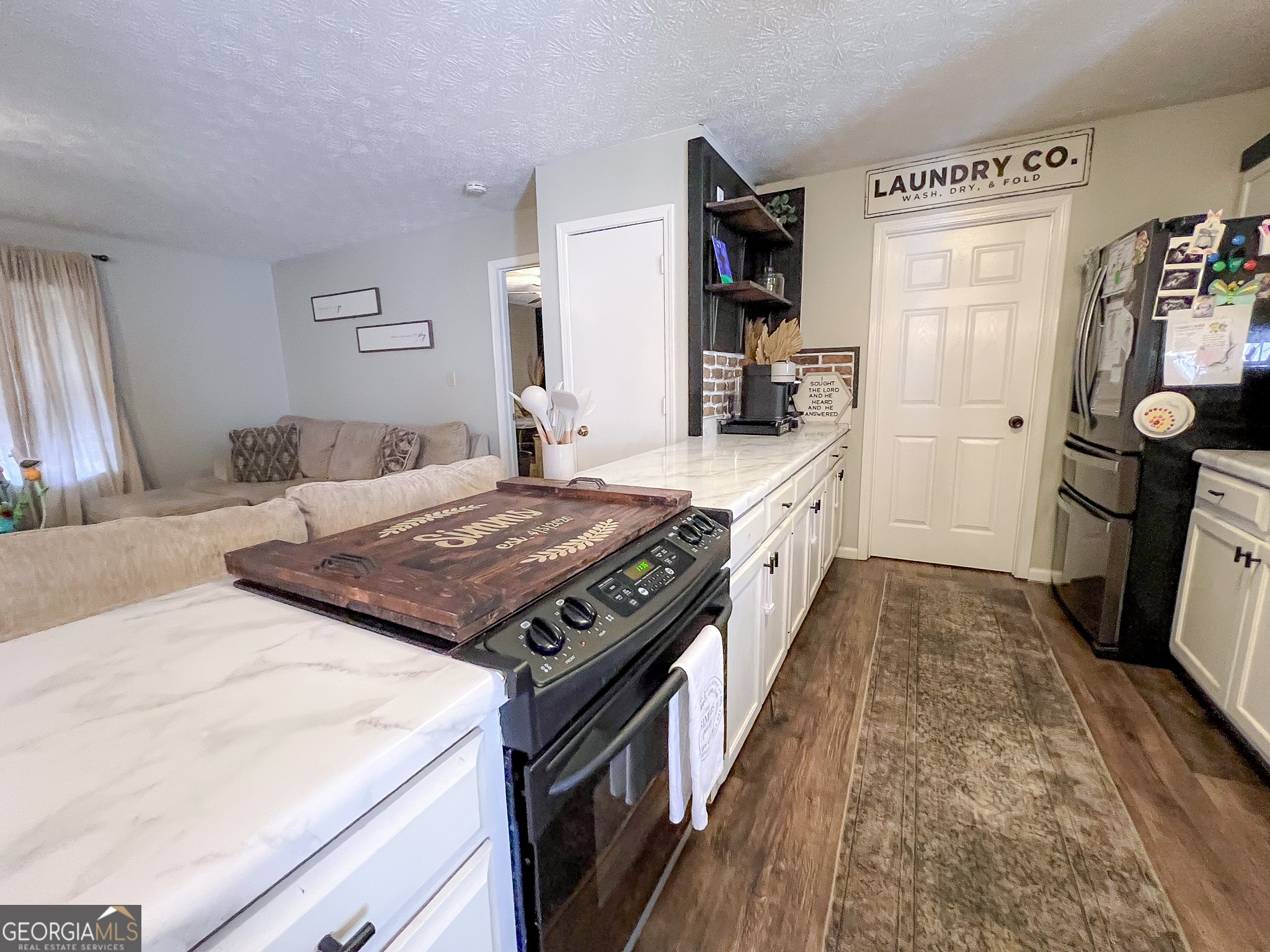 741 Howell Road Zebulon, GA 30295 - Photo 56 of 79 a kitchen with a stove and a sink