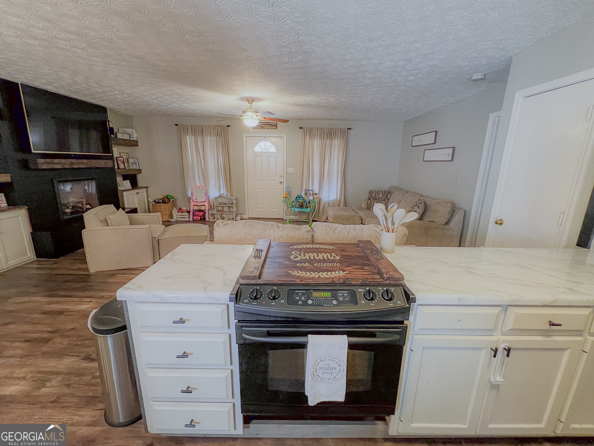 741 Howell Road Zebulon, GA 30295 - Photo 64 of 79 a kitchen with a stove and cabinets