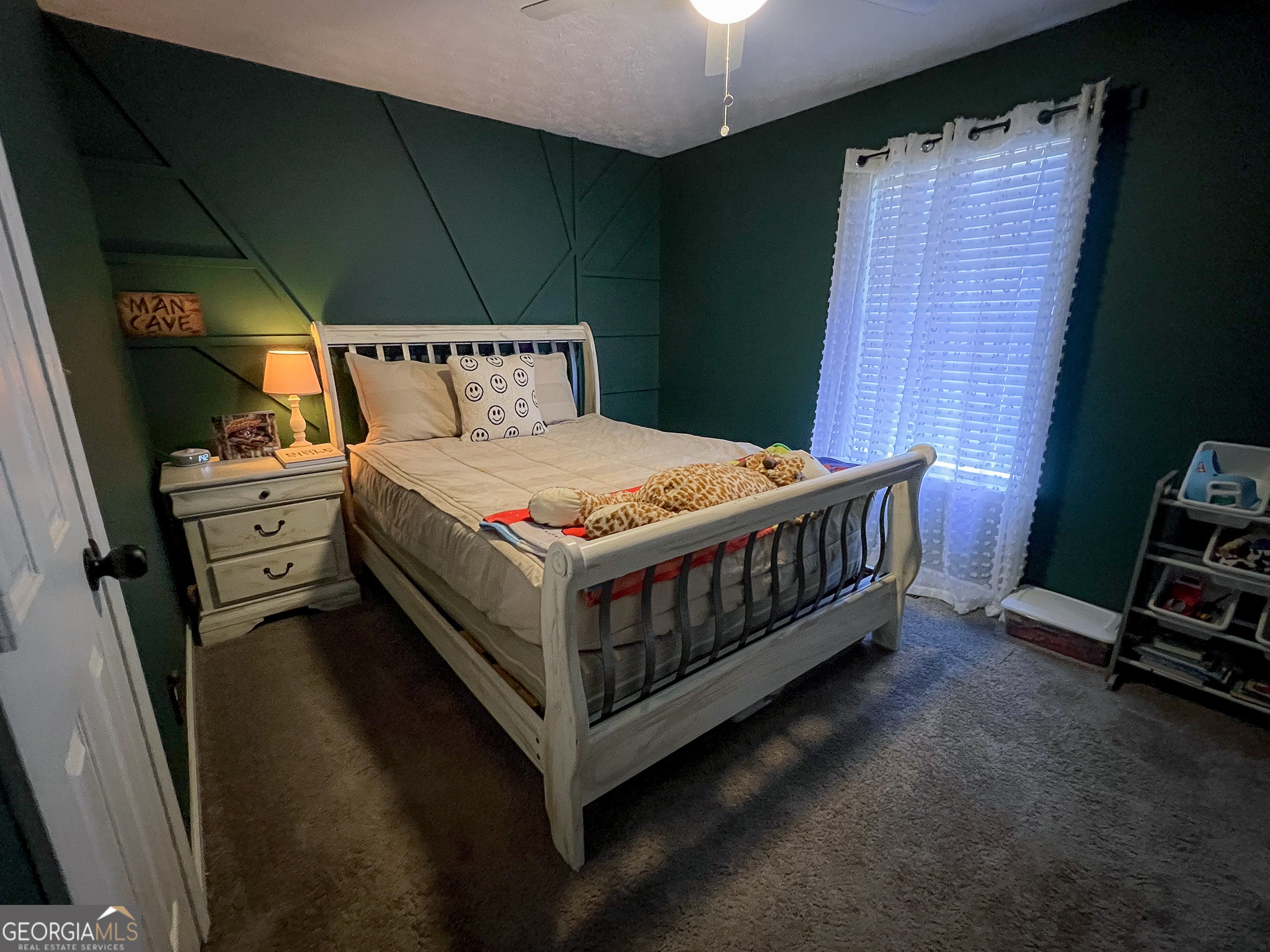 741 Howell Road Zebulon, GA 30295 - Photo 69 of 79 a bedroom with a bed and a window