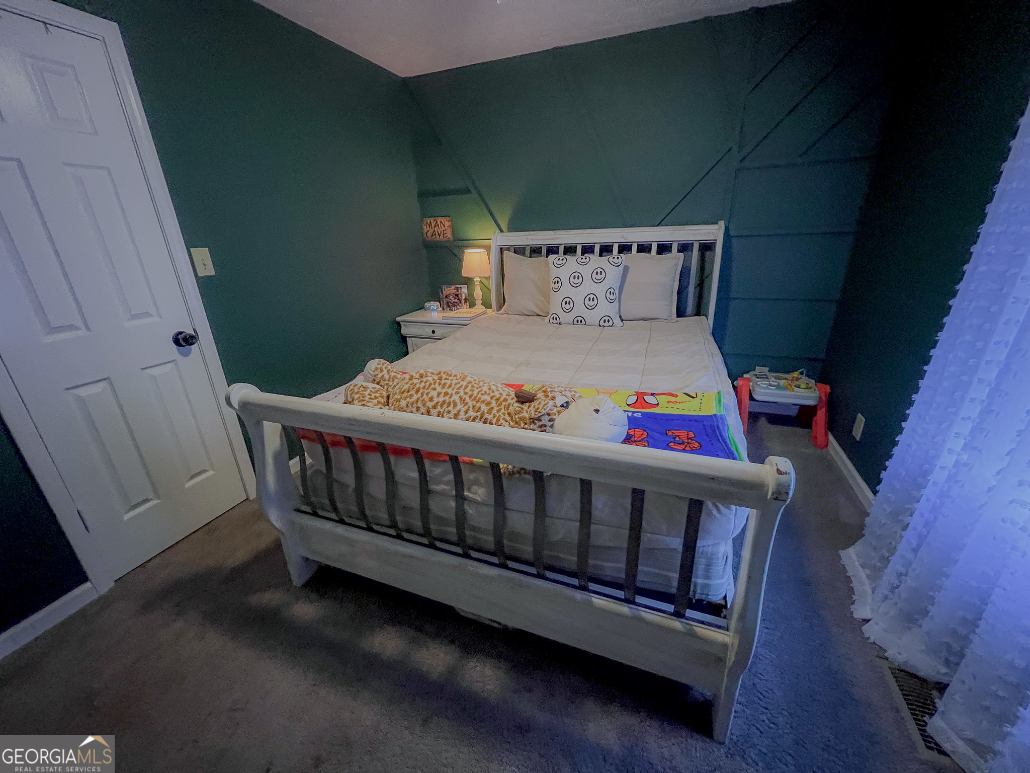741 Howell Road Zebulon, GA 30295 - Photo 71 of 79 a bedroom with furniture and a baby crib