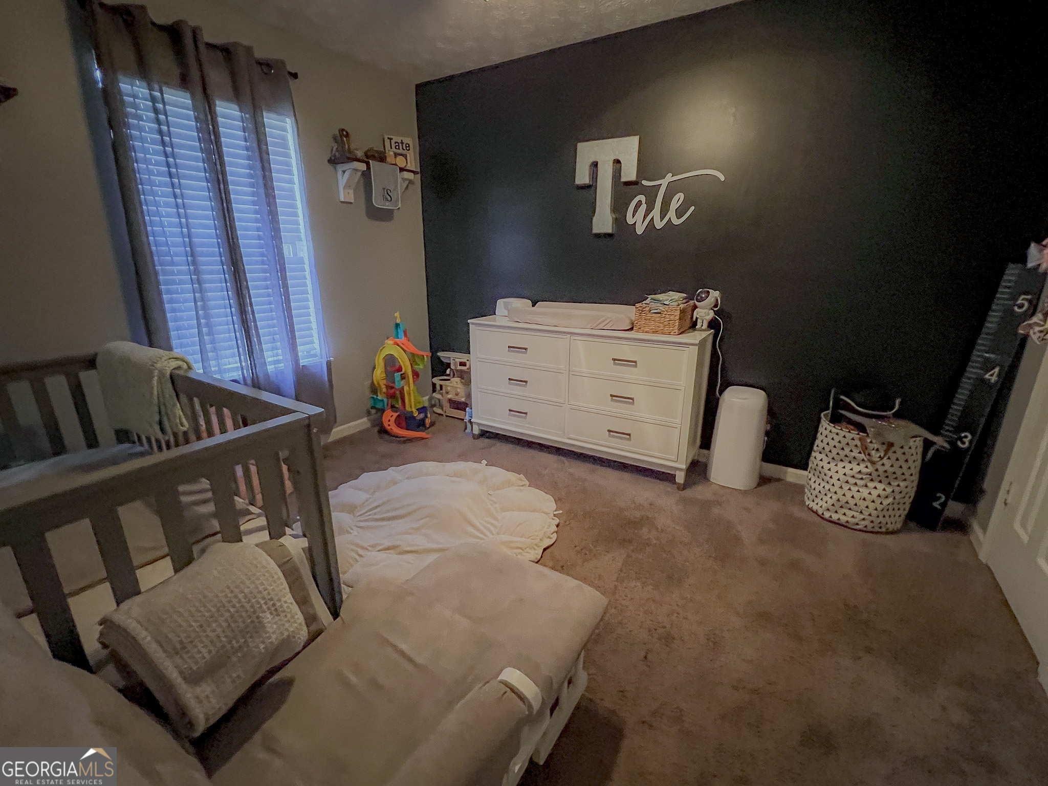 741 Howell Road Zebulon, GA 30295 - Photo 75 of 79 a bedroom with furniture and a couch