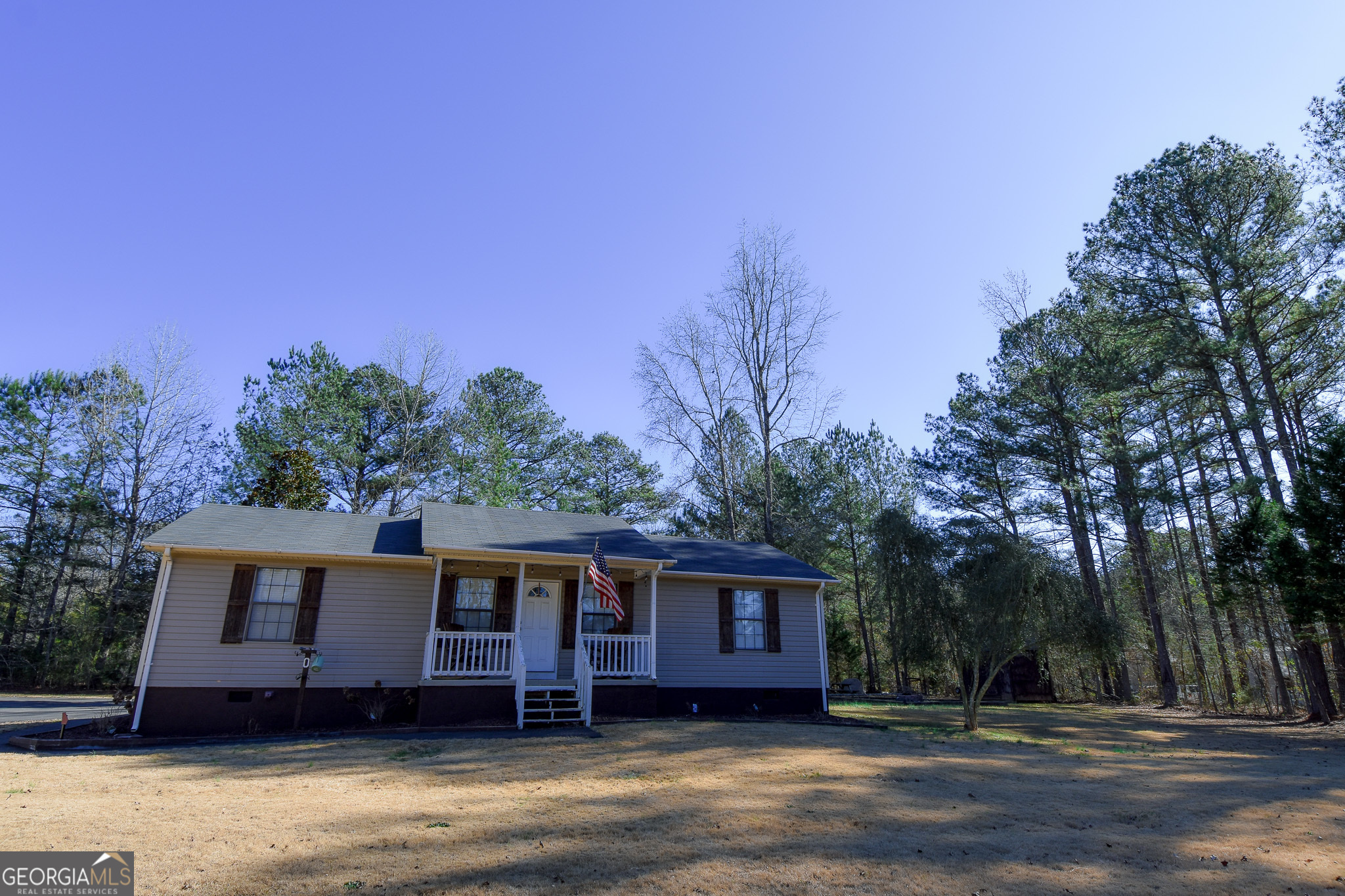 741 Howell Road Zebulon, GA 30295 - Photo 10 of 79 a front view of a house with a yard