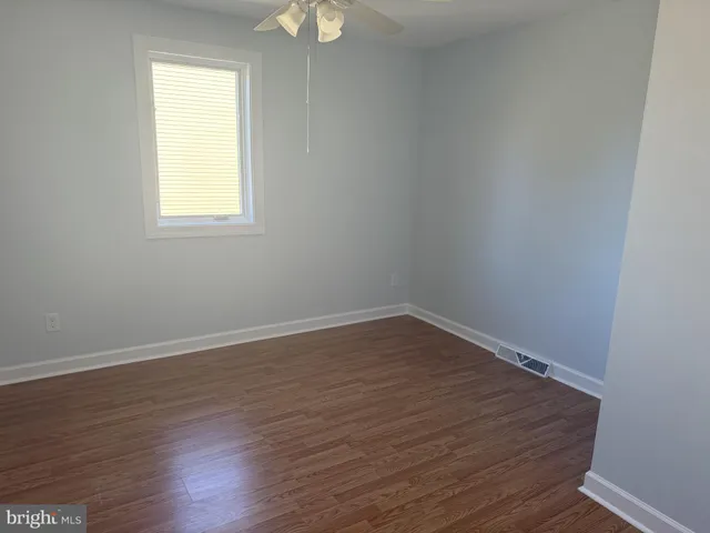 a bathroom with a sink toilet and mirror
