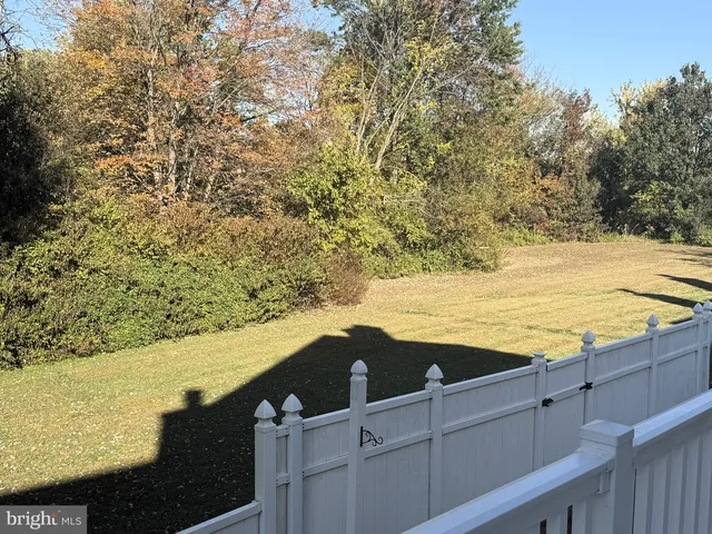 a view of a house with wooden deck