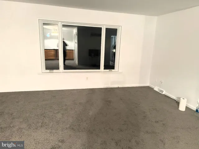 a kitchen with granite countertop a stove sink and cabinets