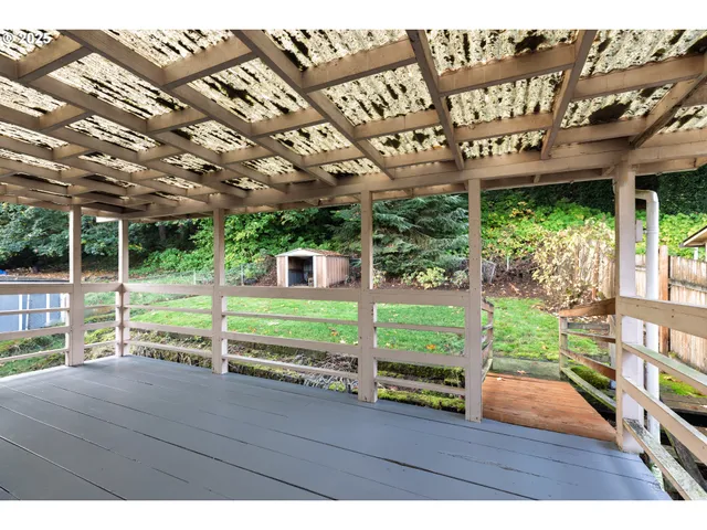 a view of a porch with wooden floor