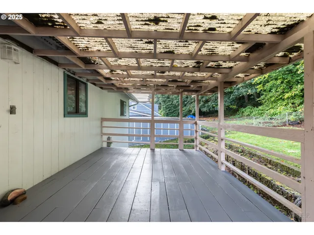 a view of a patio with wooden floor