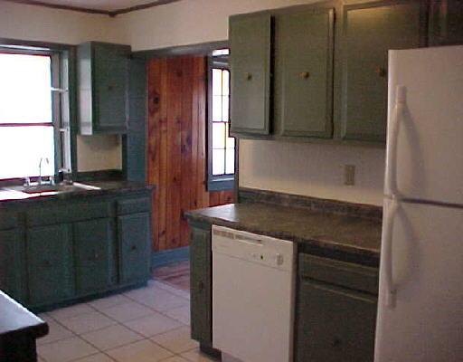 1706 Blue Ridge Springs Road Blue Ridge, VA 24064 - Photo 6 of 14 a kitchen with a refrigerator and a stove