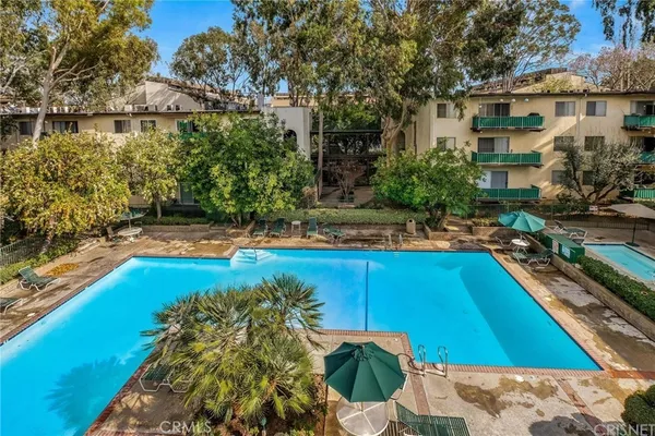 a view of a swimming pool with a patio