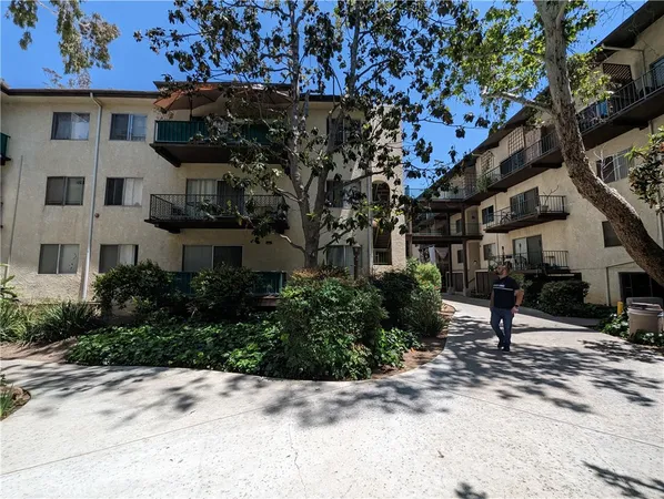a view of a porch with plants and a potted plant