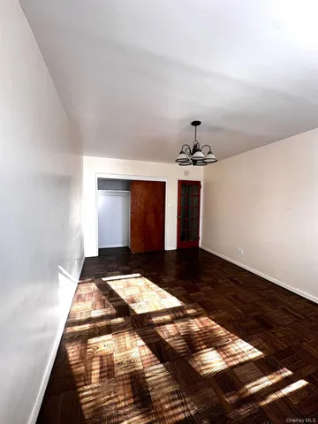a kitchen with stove and cabinets