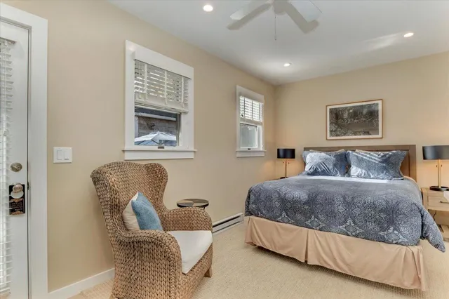 a living room with a bed furniture and a window