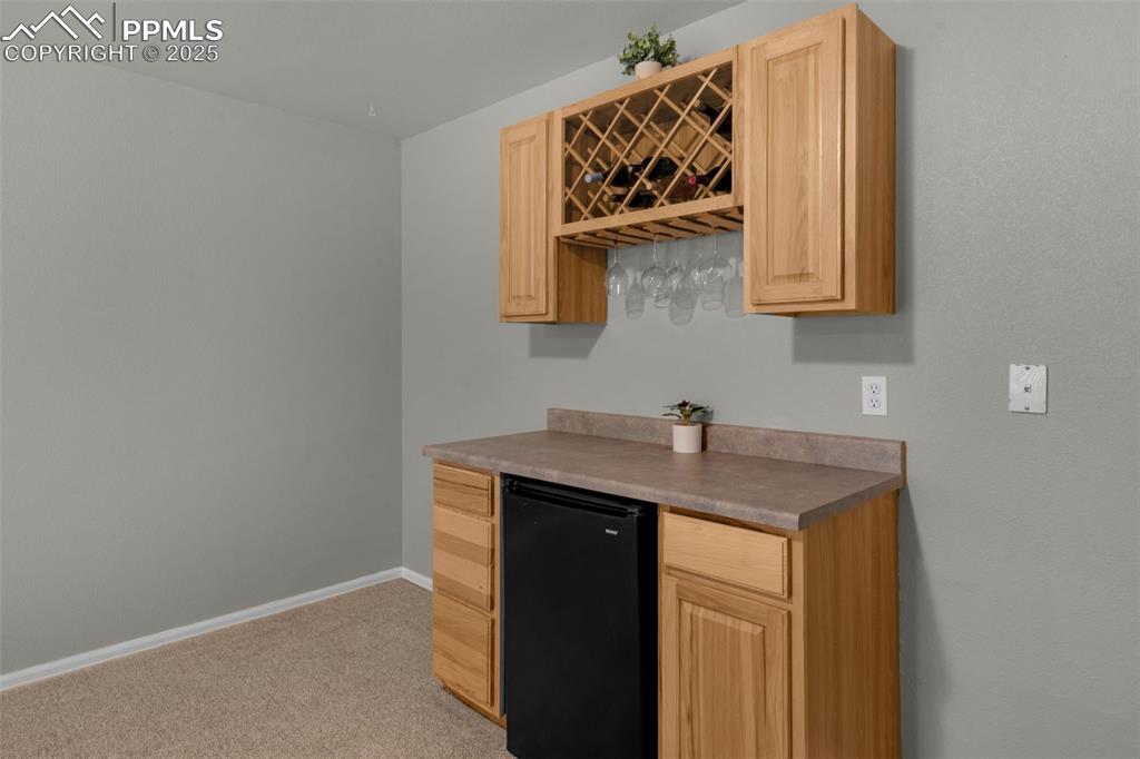 8534 Saddleman Road Peyton, CO 80831 - Photo 13 of 25 a utility room with a sink and a mirror