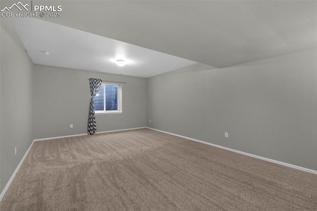 8534 Saddleman Road Peyton, CO 80831 - Photo 17 of 25 a view of an empty room with windows
