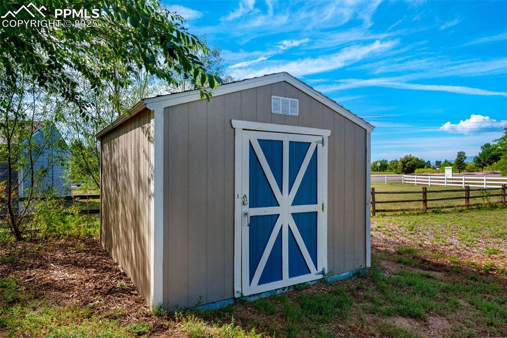8534 Saddleman Road Peyton, CO 80831 - Photo 22 of 25 a backyard of a house with lots of green space