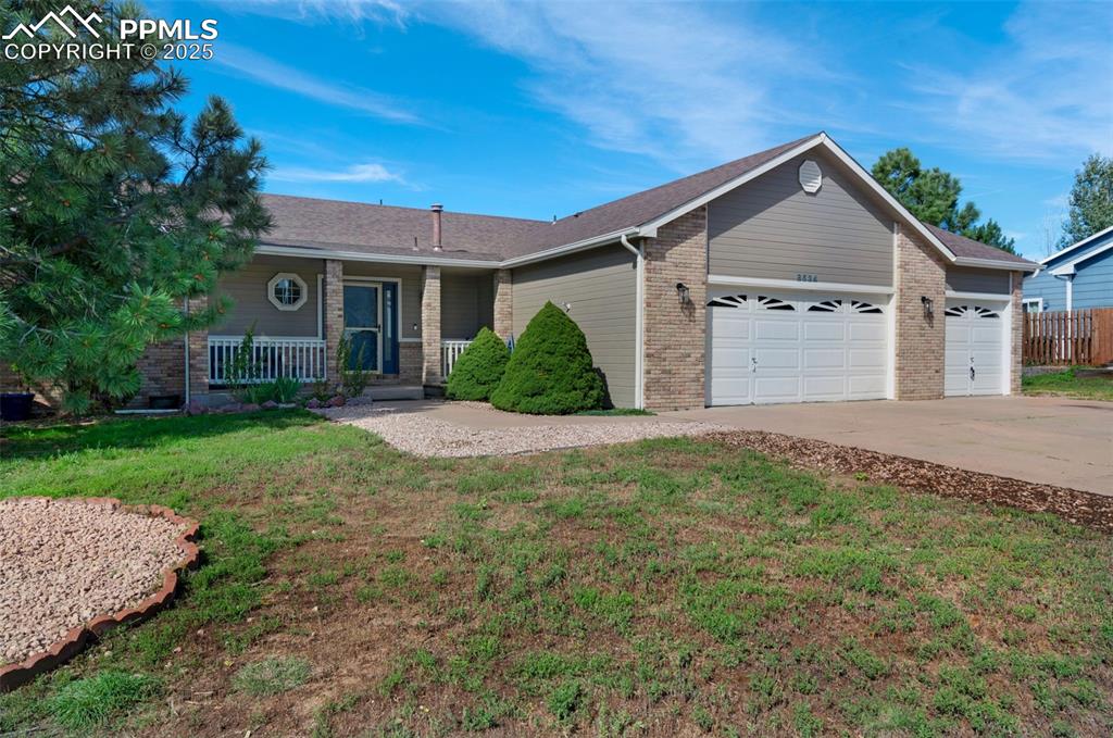 8534 Saddleman Road Peyton, CO 80831 - Photo 23 of 25 a view of a house with yard and plants