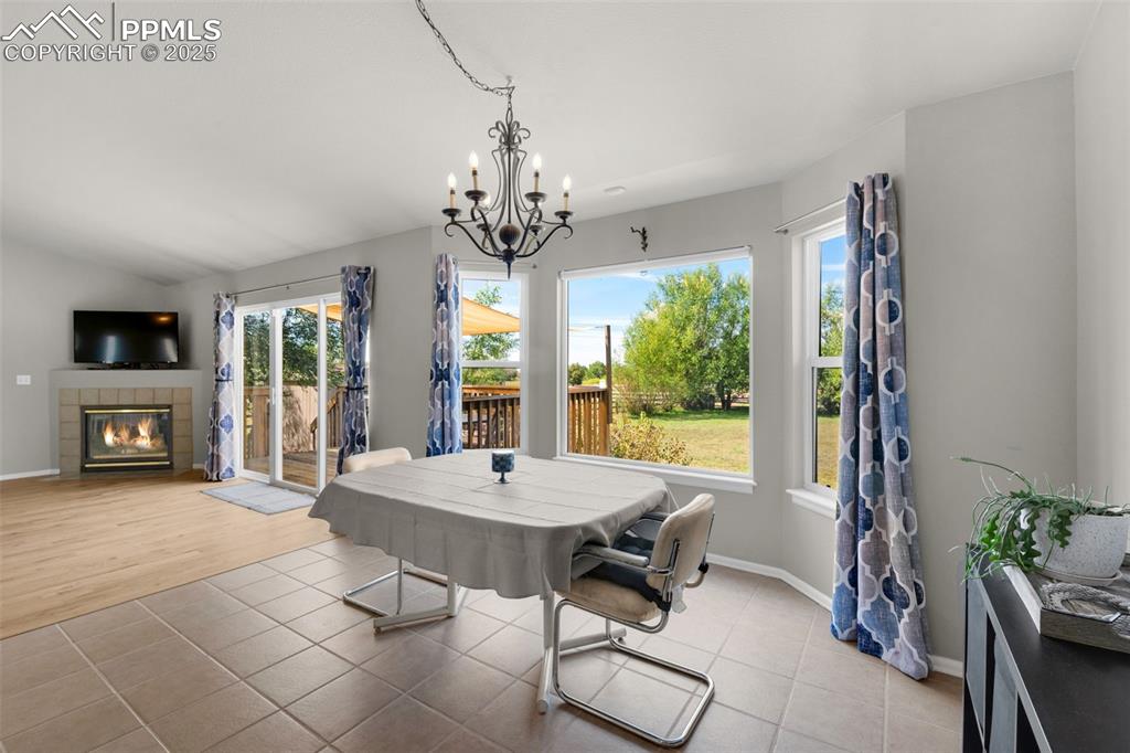 8534 Saddleman Road Peyton, CO 80831 - Photo 4 of 25 a view of a dining room with furniture window and outside view