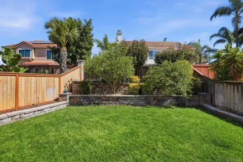 a garden with wooden fence