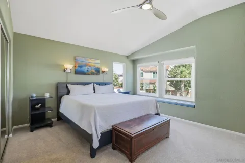 a bedroom with bed and window