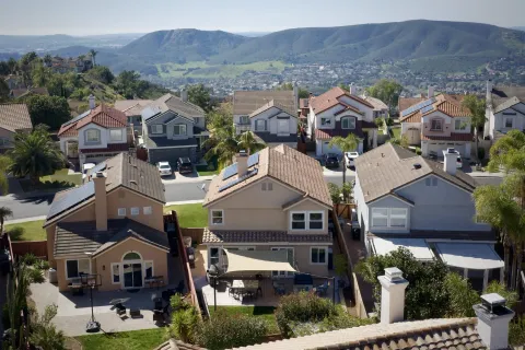 an aerial view of residential houses and outdoor space