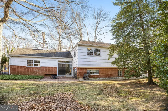 a front view of a house with a yard table and chairs