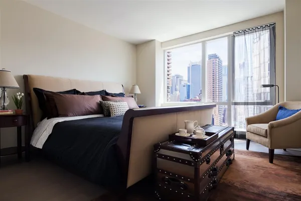 a bedroom with furniture and windows