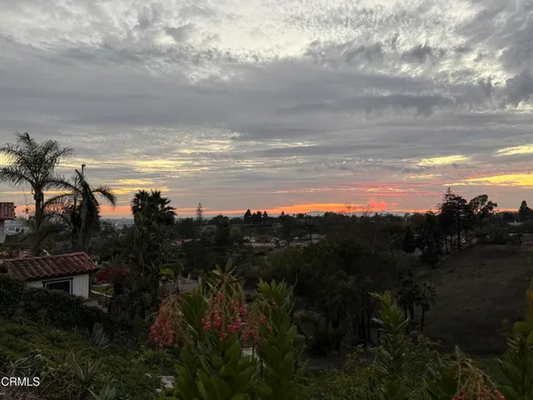 a view of a pathway with a ocean view