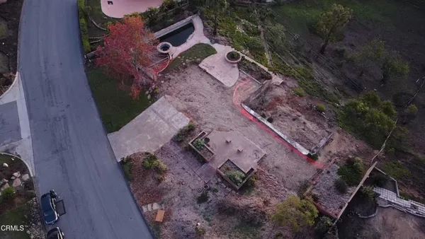 a aerial view of a house with a yard