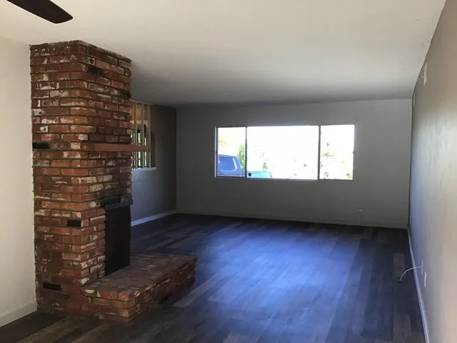 a view of wooden floor in an empty room