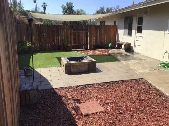 a view of a back yard of the house