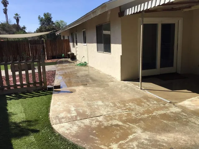 a view of a backyard of the house