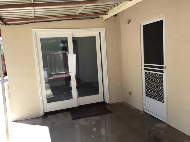 a view of a hallway with a room