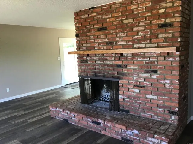 a living room with a fireplace