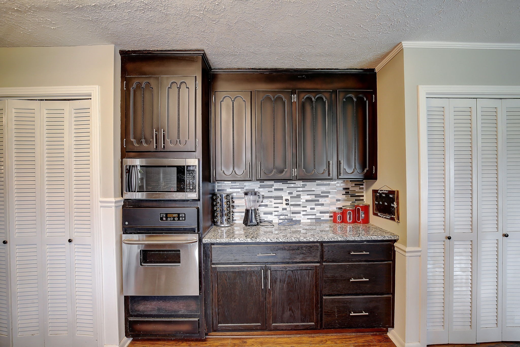 1611 Salt Lick Place Murfreesboro, TN 37129 - Photo 24 of 75 a kitchen with wooden cabinets and a stove