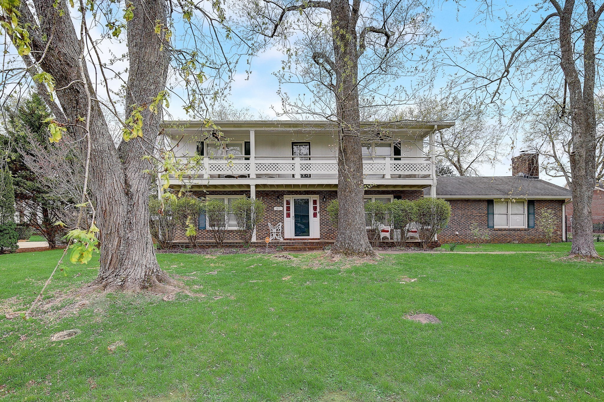 1611 Salt Lick Place Murfreesboro, TN 37129 - Photo 5 of 75 a view of a yard in front of a house with a large tree