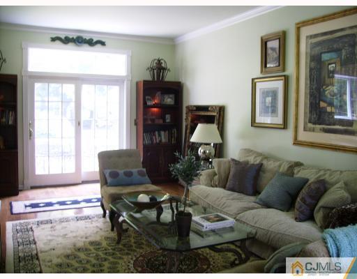 7 Taylor Road Monmouth Junction, NJ 08852 - Photo 3 of 10 a living room with furniture and a window