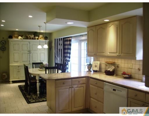 7 Taylor Road Monmouth Junction, NJ 08852 - Photo 5 of 10 a kitchen with a sink cabinets and window