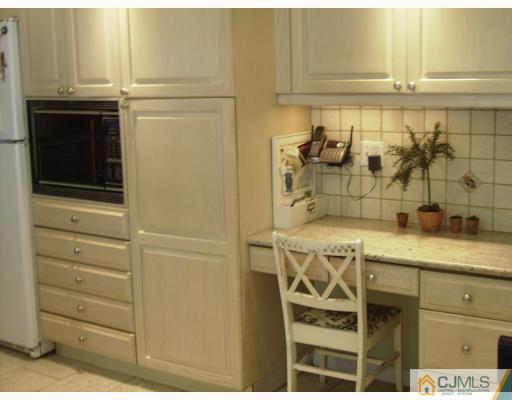 7 Taylor Road Monmouth Junction, NJ 08852 - Photo 8 of 10 a bathroom with a sink and cabinets
