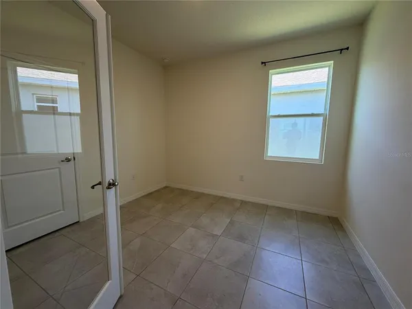 a view of an empty room with a window