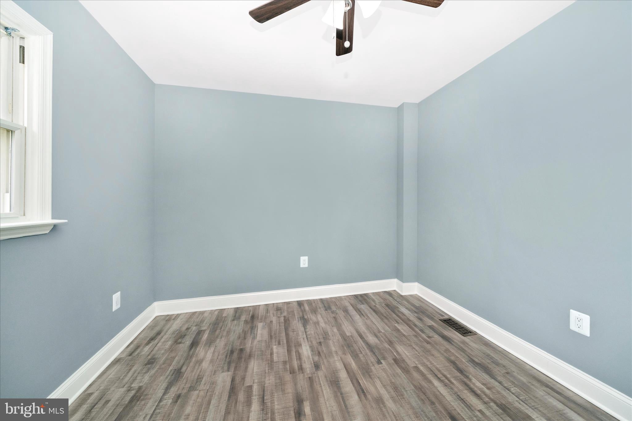 6737 Allentown Road Temple Hills, MD 20748 - Photo 47 of 51 a view of a room with wooden floor and fan